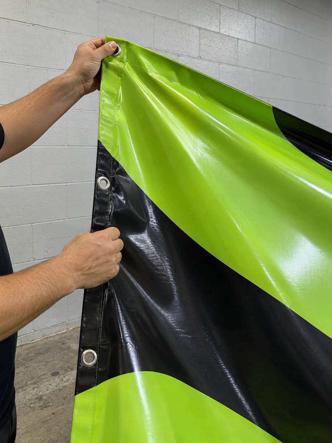 Holding up a printed vinyl banner